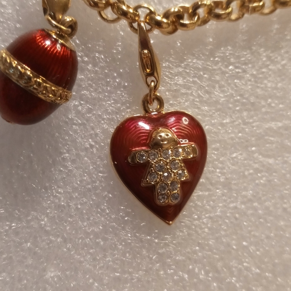 Faberge egg charm bracelet on a gold tone rolo chain. - Picture 9 of 16